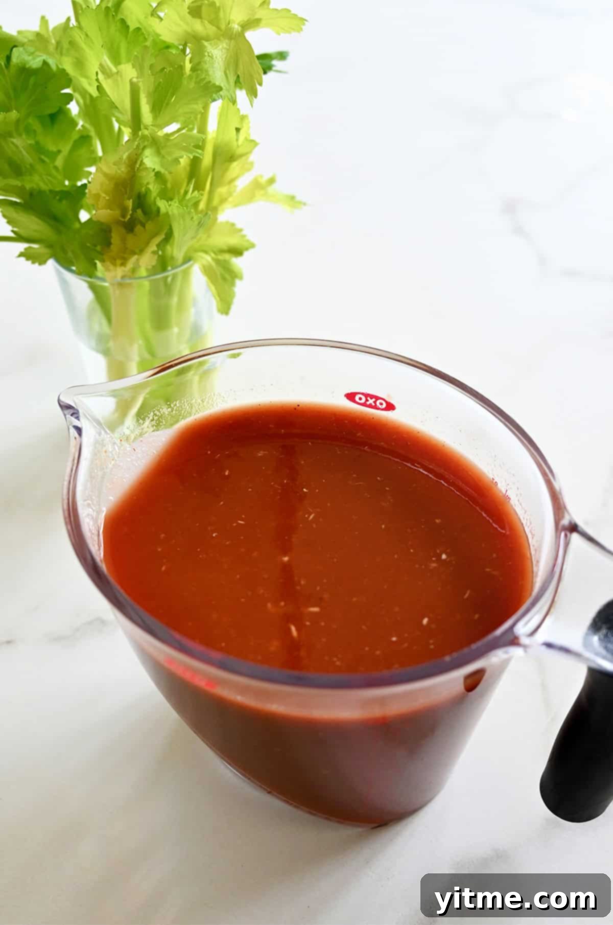 Bloody Mary Pitchers 4 Bloody Mary mix in a large pitcher.