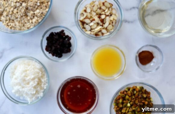 Orange-Kissed Honey Granola Parfaits 3 Glass bowls containing the ingredients for homemade granola