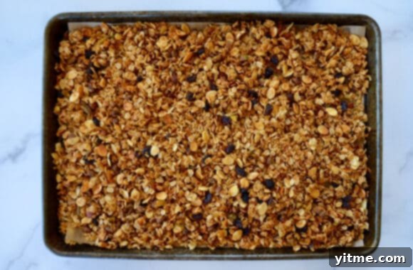 Orange-Kissed Honey Granola Parfaits 5 A baking sheet containing honey granola