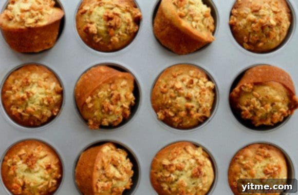Top down view of homemade Banana Granola Muffins in muffin pan