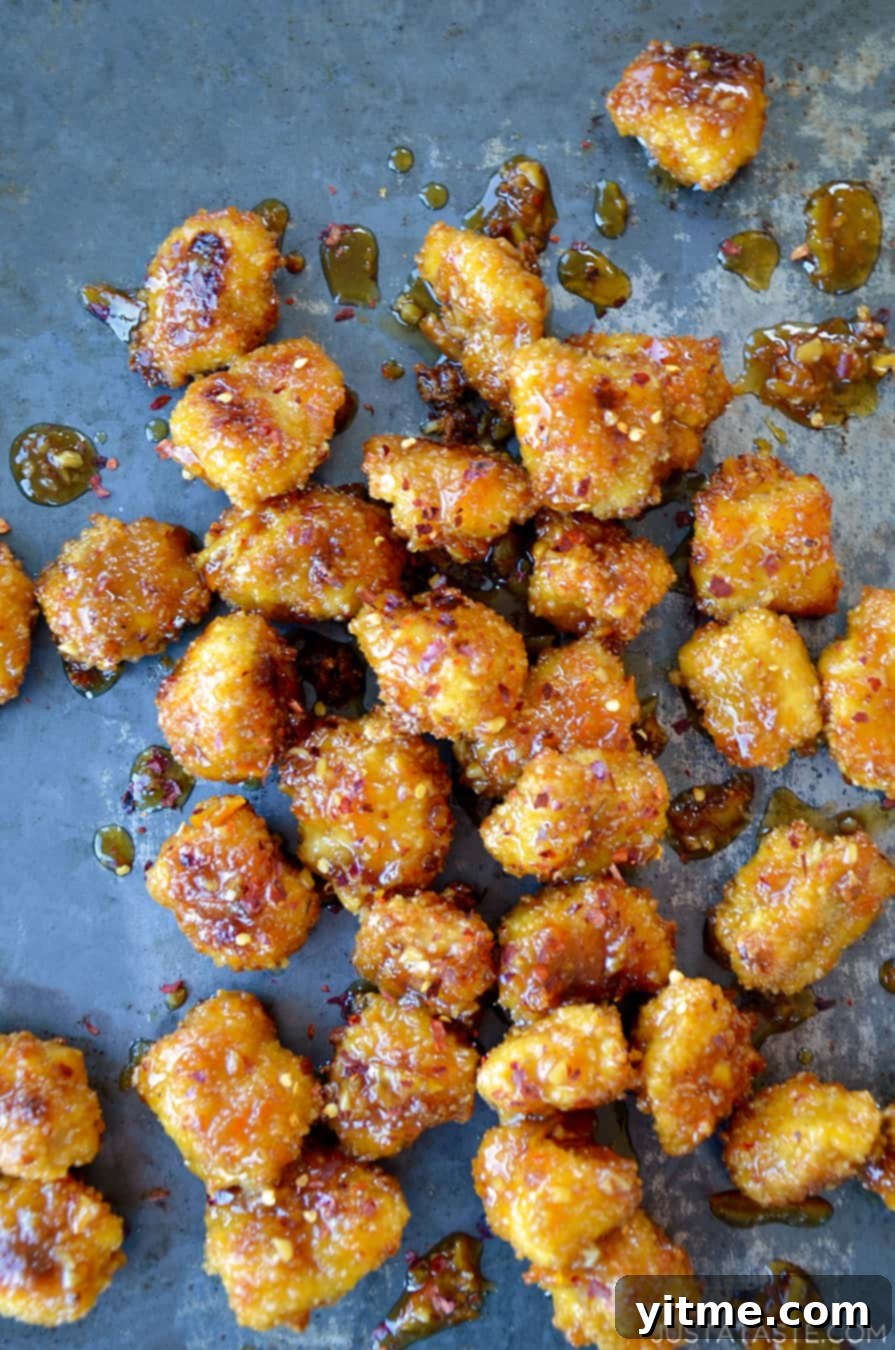 Crispy Citrus Chicken Bites 7 Baked Orange Chicken Poppers on a baking sheet