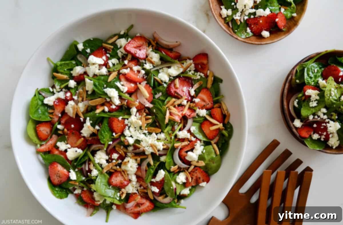 Spinach salad with strawberries, feta, almonds, and poppy seed dressing
