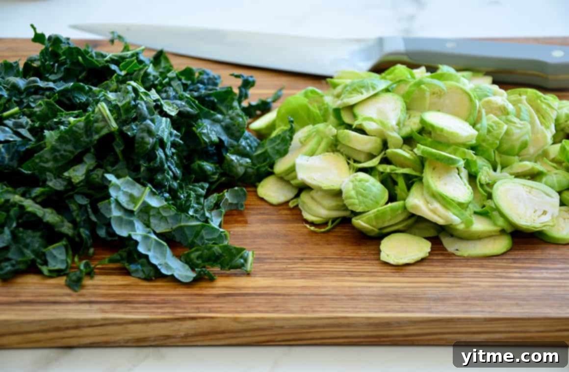 Tortellini Soup with Tuscan Kale 4 Chopped kale and Brussels sprouts on a cutting board.
