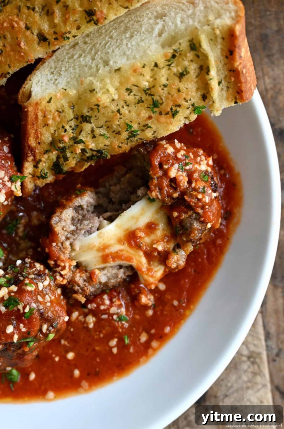 Mozzarella Stuffed Meatballs in Marinara Sauce with Garlic Bread