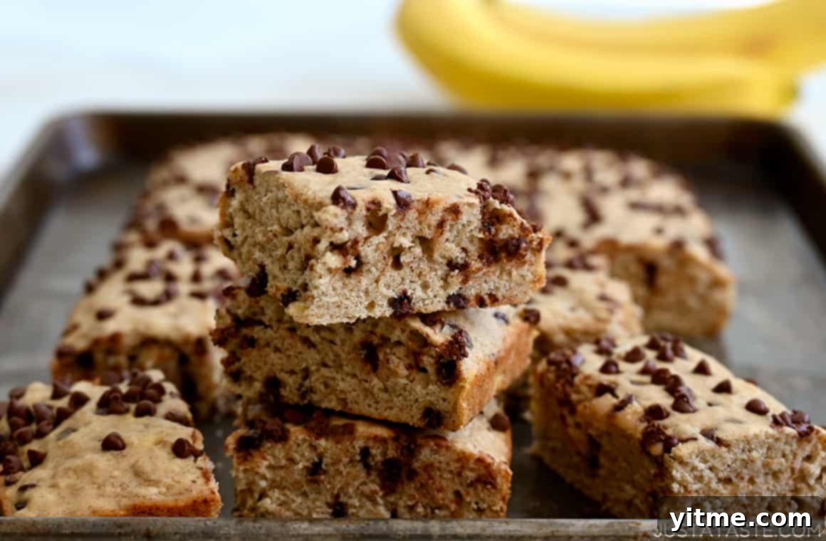 Banana bars with bananas in the background