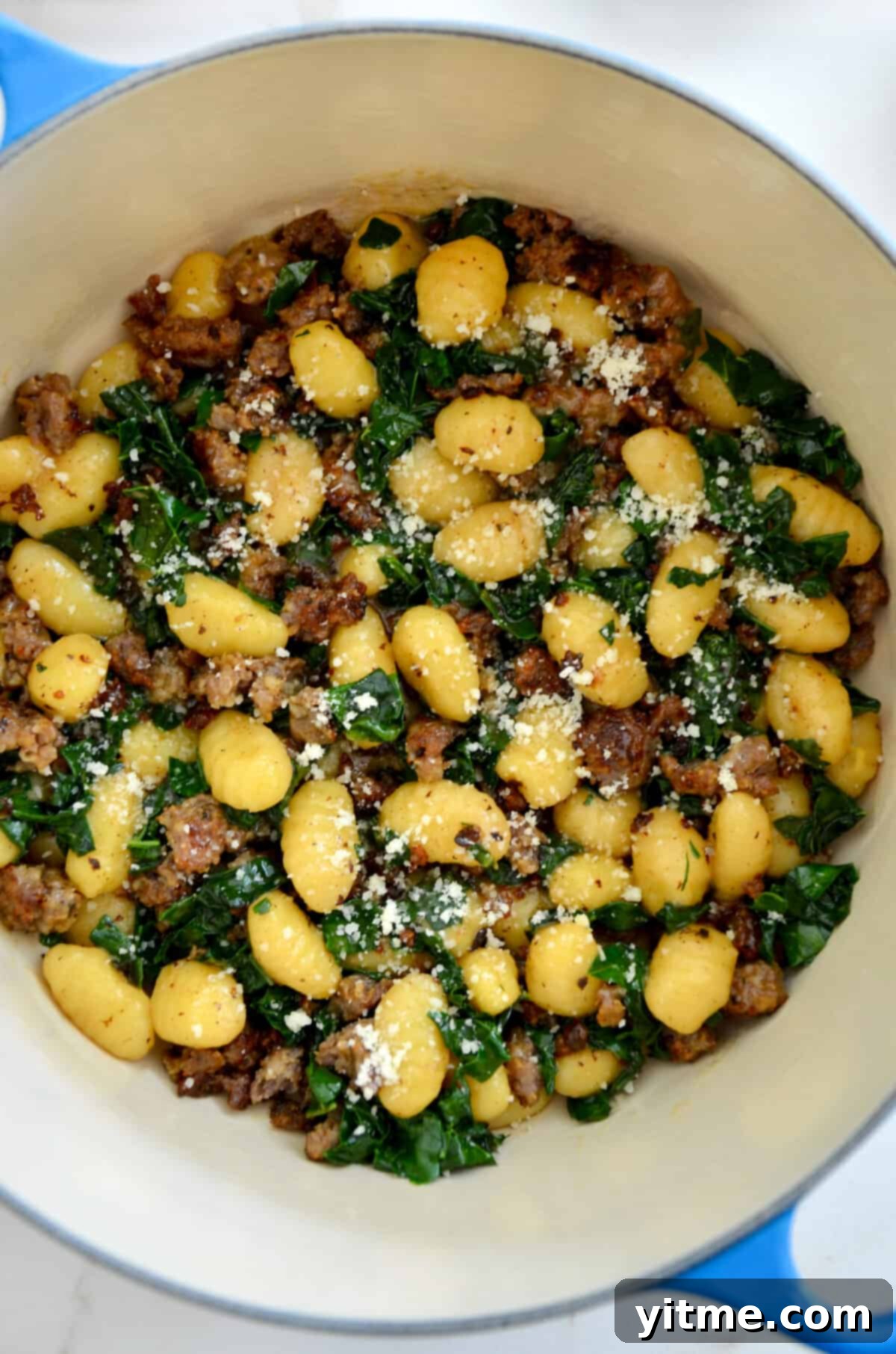 A close-up view of One-Pot Gnocchi with Sausage and kale in a large stock pot, ready to be served as a delightful and quick meal.