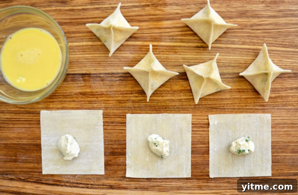 Creamy Air Fryer Wonton Bites 3 Preparing Air Fryer Cream Cheese Wontons: Wonton wrappers filled with cream cheese mixture.