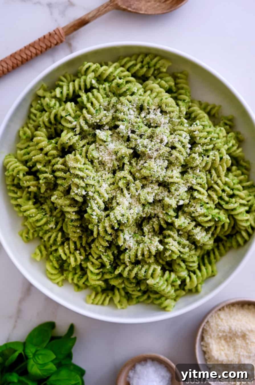 Broccoli Pesto Pasta garnished with parmesan cheese