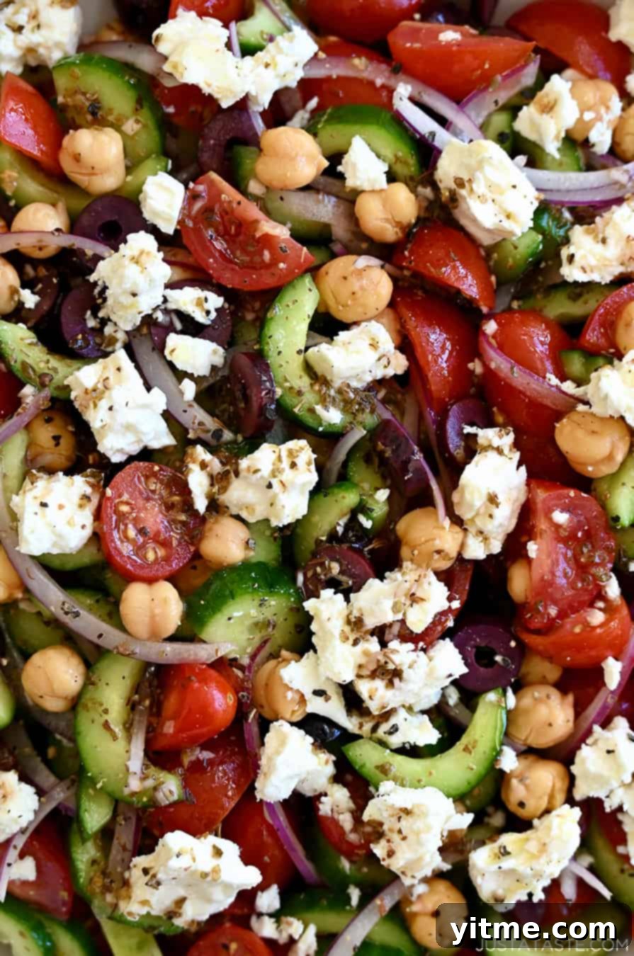 A close-up of the vibrant and colorful Mediterranean-inspired Greek Cucumber Tomato Salad