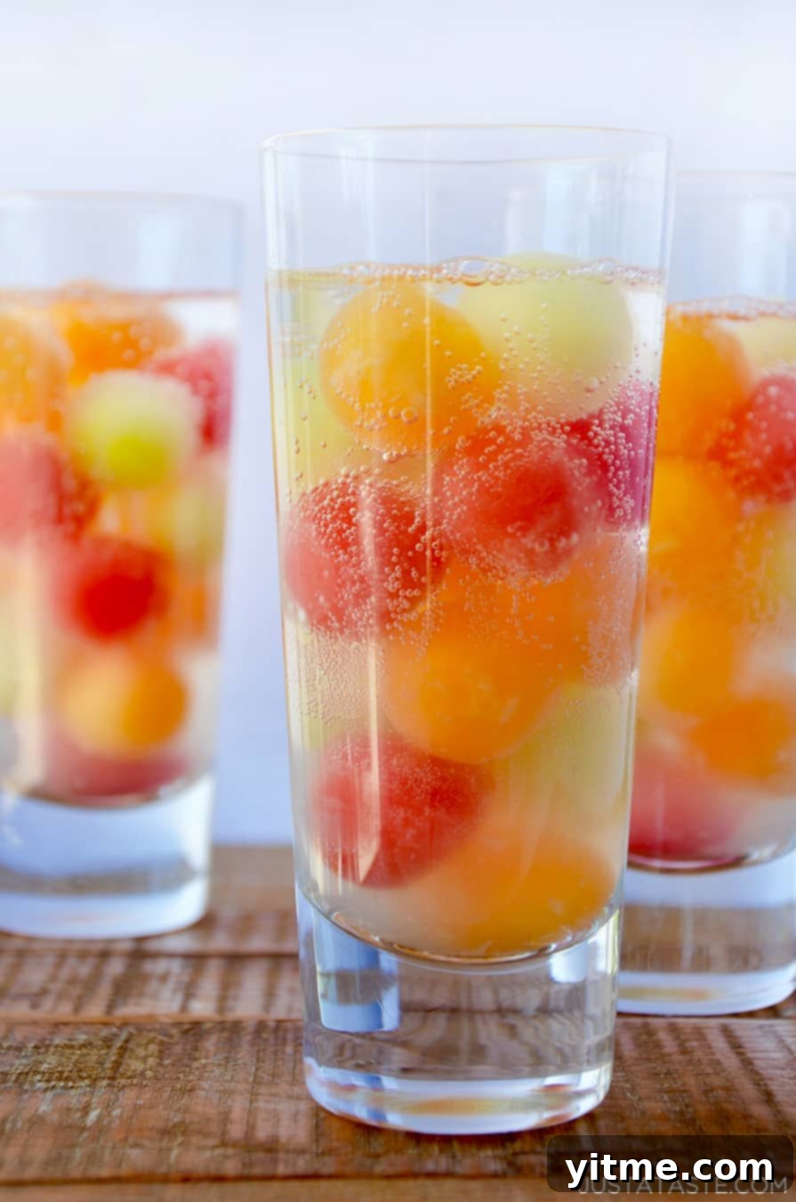 Zesty Lemonade Twists 5 A refreshing Melon Ball Cocktail with cantaloupe, watermelon, and honeydew melon balls in drinking glasses