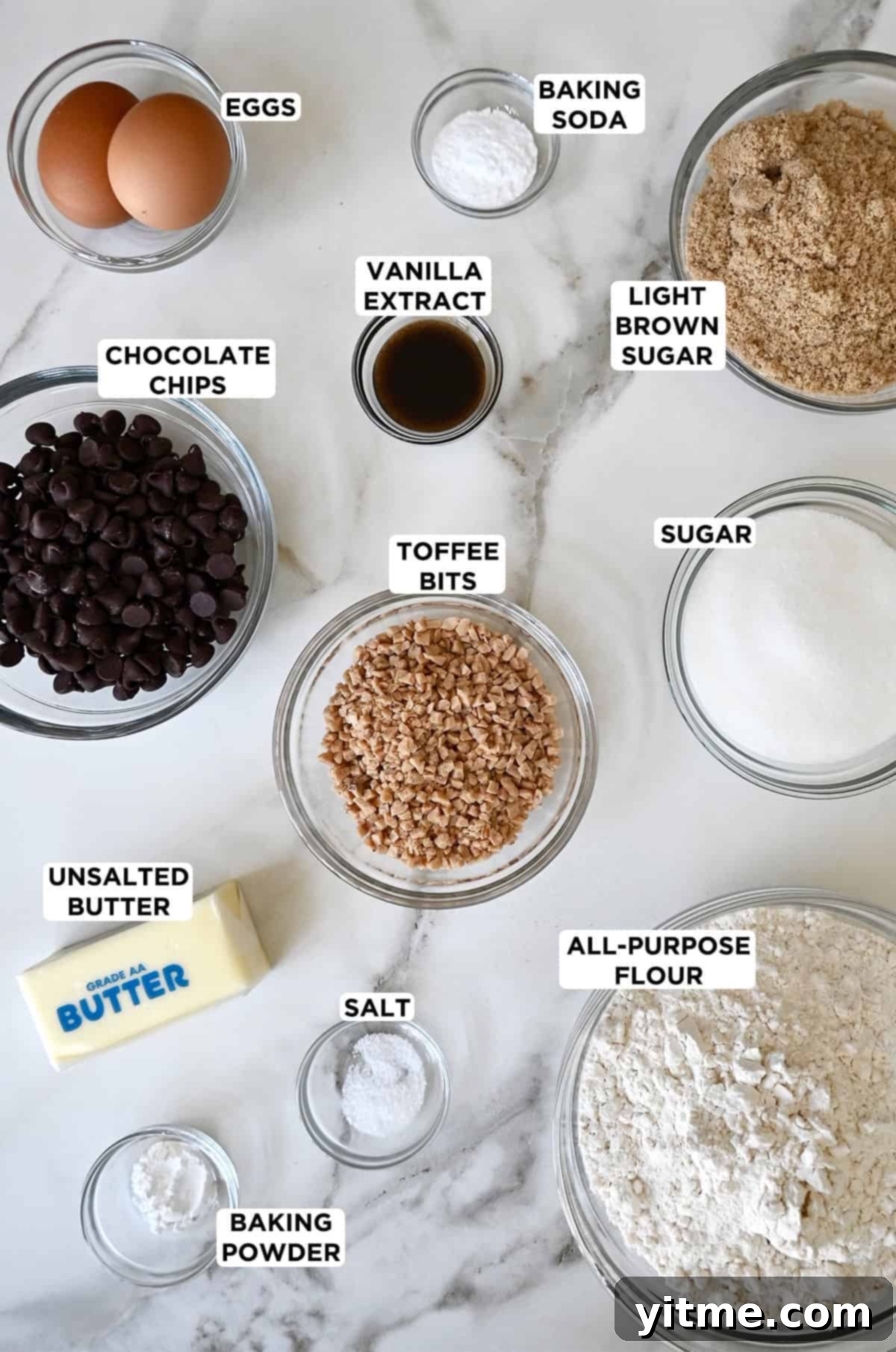 Ingredients for toffee cookies including butter, sugar, eggs, flour, and toffee bits