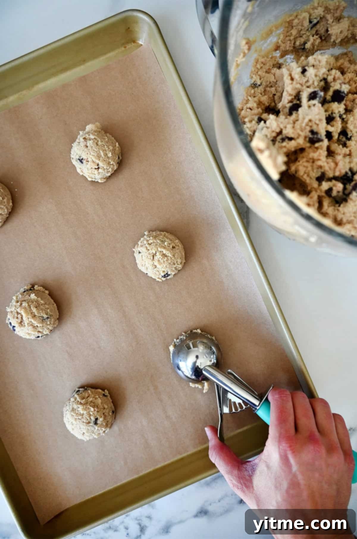 Scooping cookie dough onto baking sheet