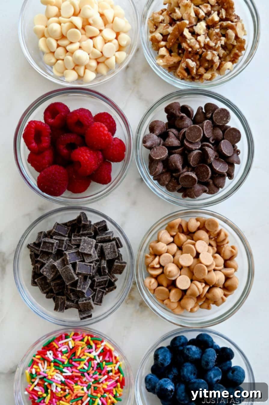 Mini Banana Bread Bites 3 A captivating top-down view of an assortment of small bowls, each brimming with a variety of delectable toppings including white chocolate chips, walnut pieces, juicy raspberries, classic chocolate chips, decadent chocolate chunks, creamy peanut butter chips, vibrant rainbow sprinkles, and plump blueberries, ready to be incorporated into the mini banana bread loaves.