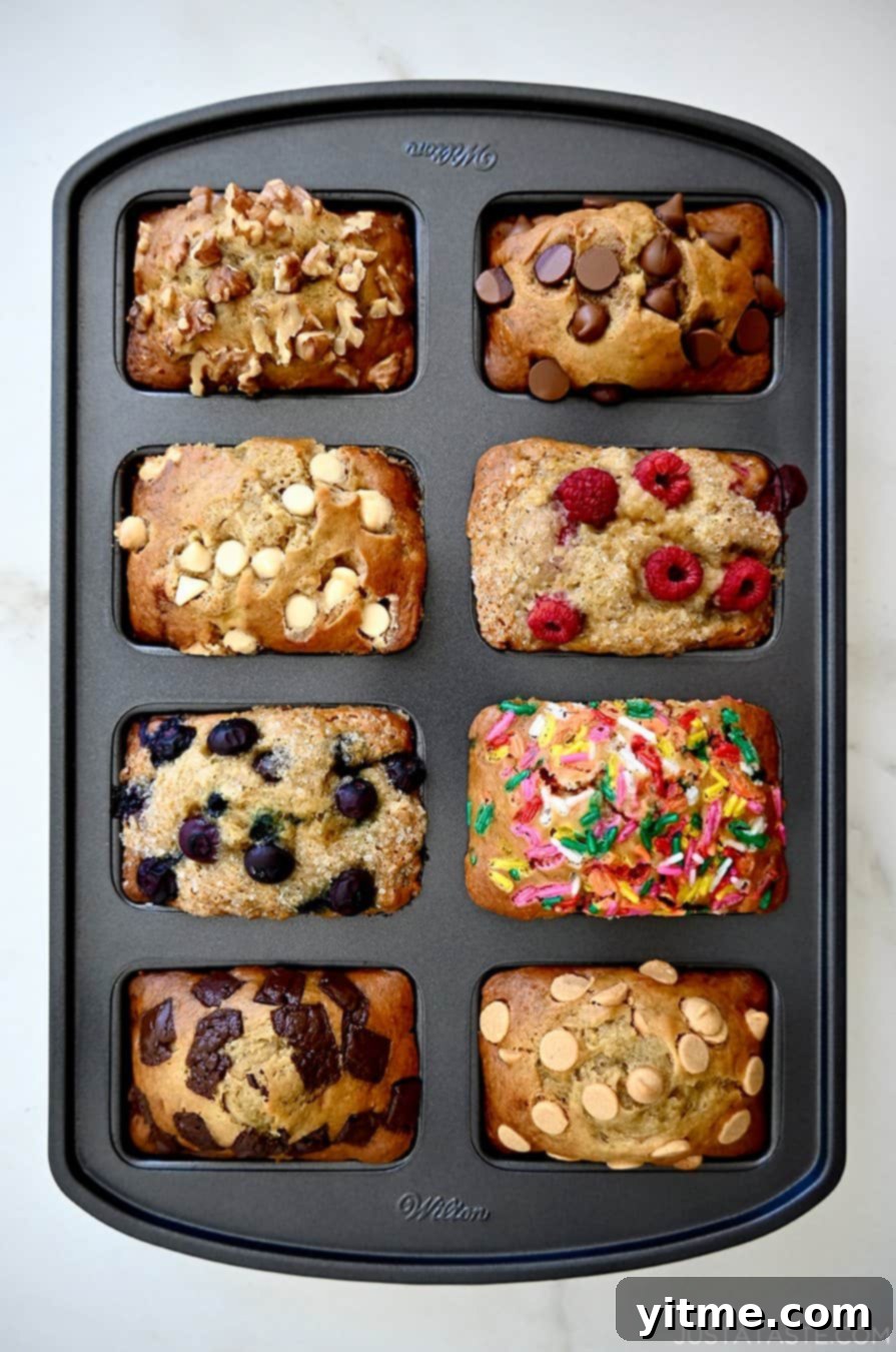 Mini Banana Bread Bites 5 A visually appealing top-down shot of freshly baked mini banana bread loaves still nestled within their pan, showcasing their golden-brown color and perfectly risen texture.