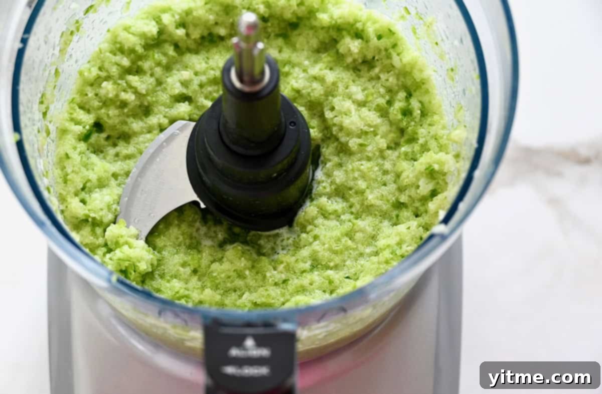 Sofrito (pureed onion, green pepper and garlic) in a food processor.