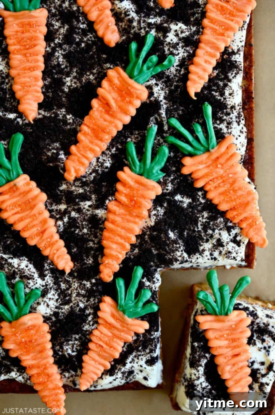 Zesty Carrot Cake Squares with Creamy Frosting 8 Easy carrot cake topped with frosting, crushed Oreos, and candy melts in the shape of carrots