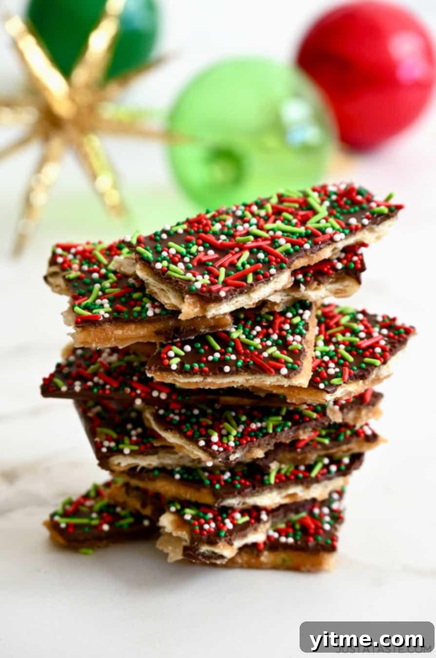 A tall stack of Christmas Saltine Cracker Toffee