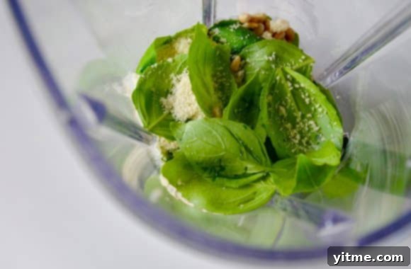 Basil pesto ingredients inside a blender