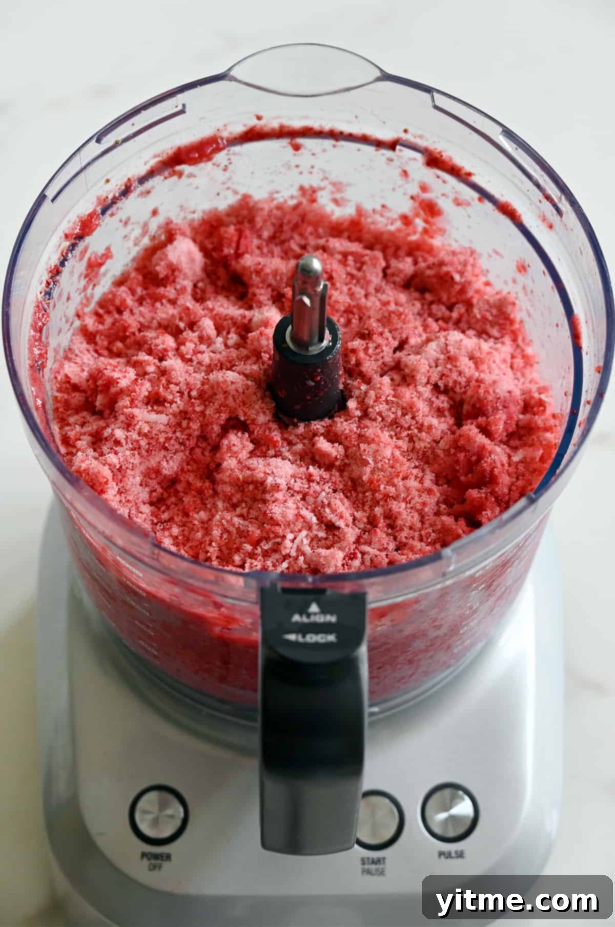 Strawberry shaved ice inside a food processor