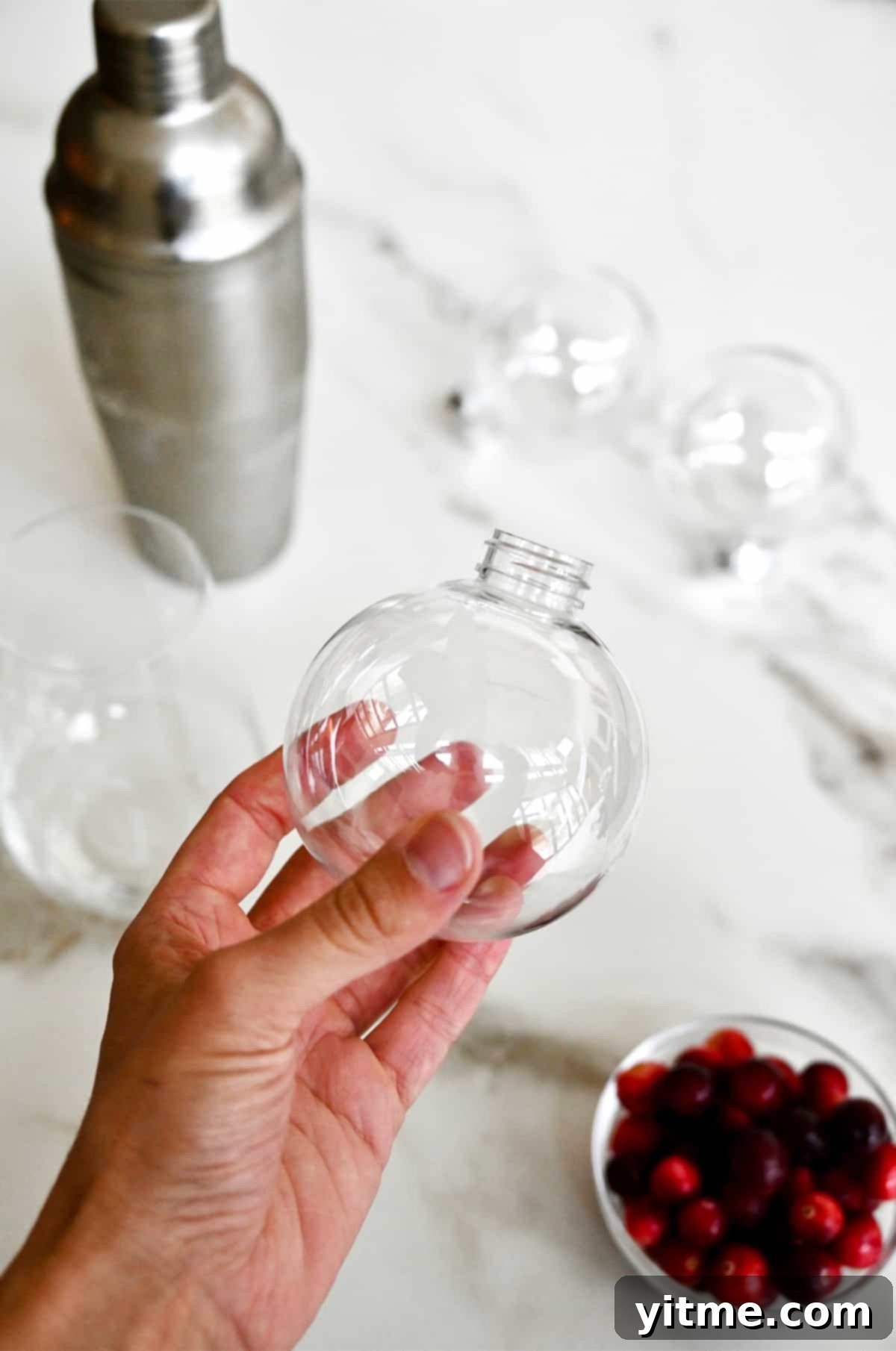 Christmas Margarita served in a clear ornament ball