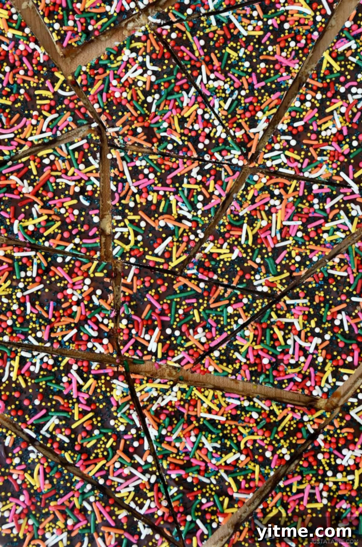 Oyster cracker toffee bark topped with vibrant sprinkles.