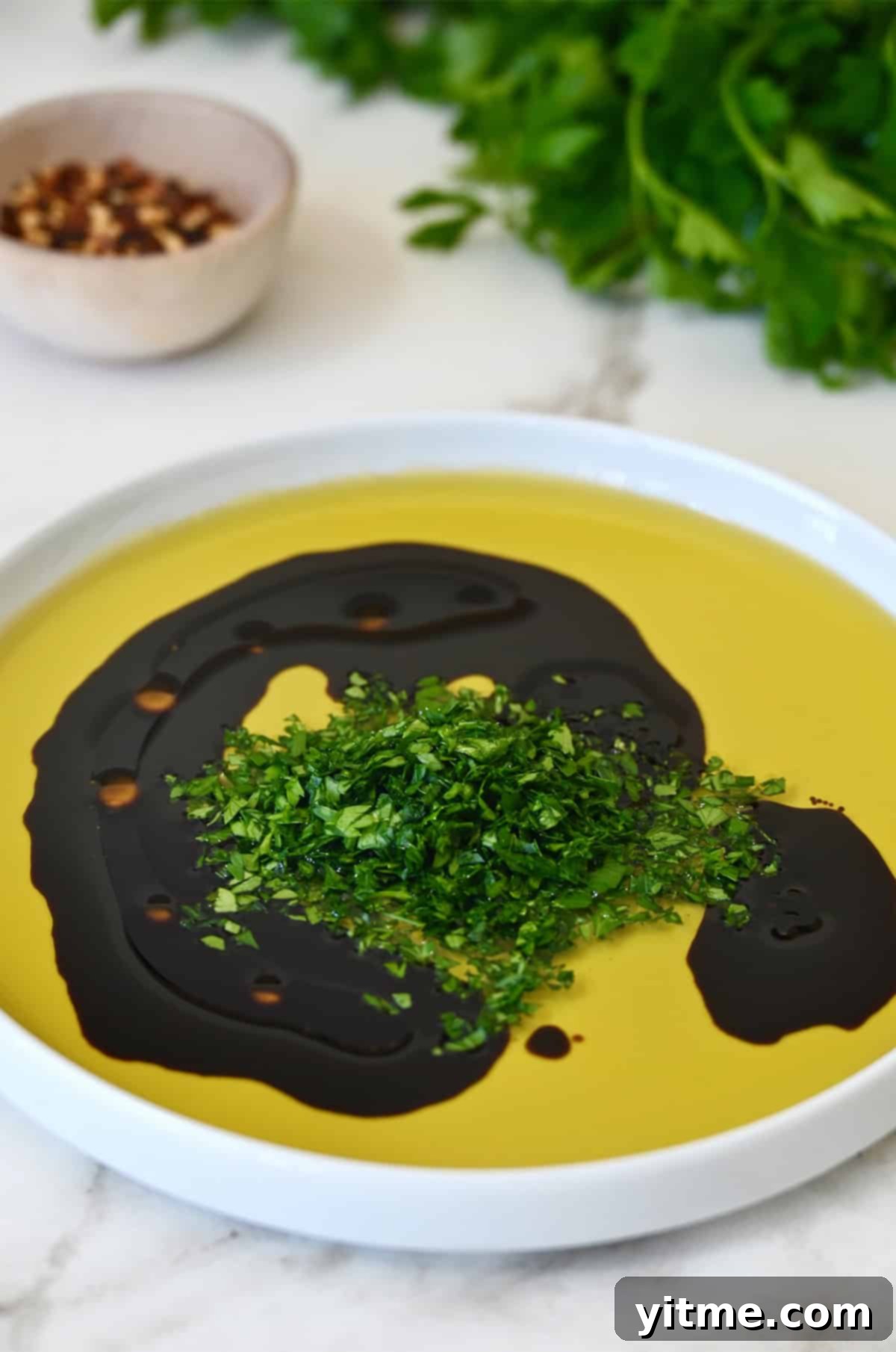 Chopped parsley added to the olive oil and balsamic vinegar