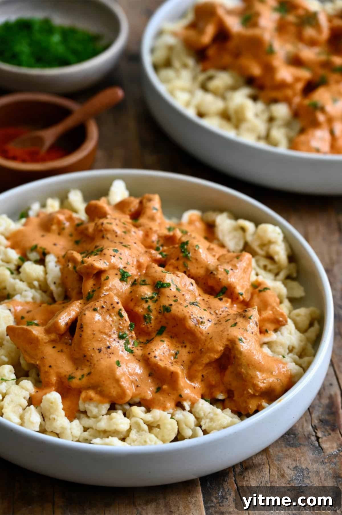 Chicken paprikas atop spaetzle.