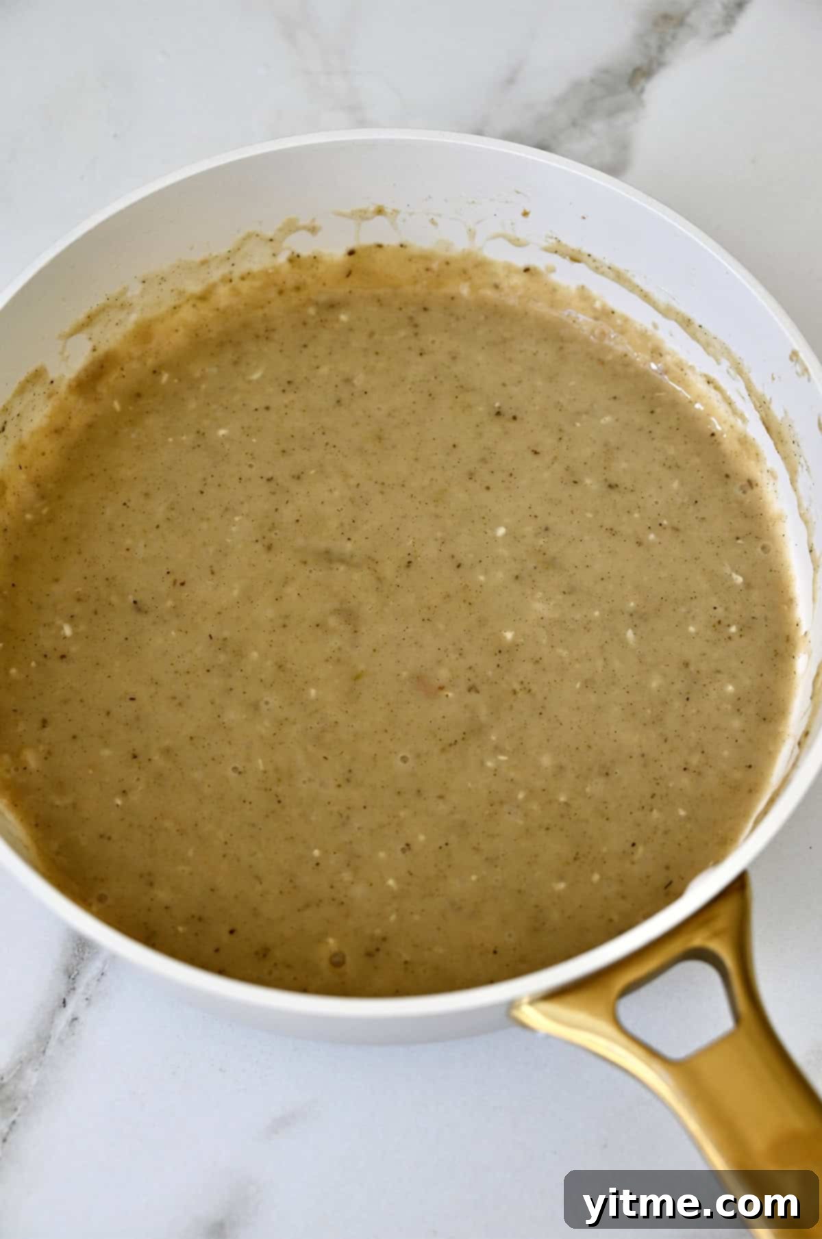 Homemade gravy in a pan.
