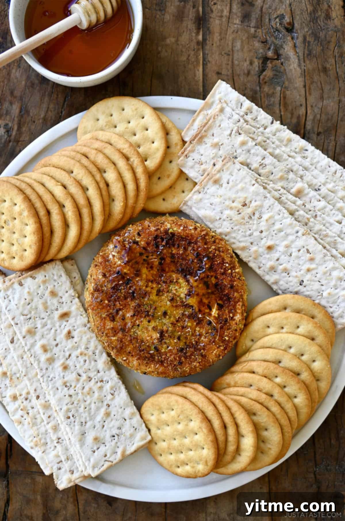 Pan fried brie with a pistachio crust served with crackers.