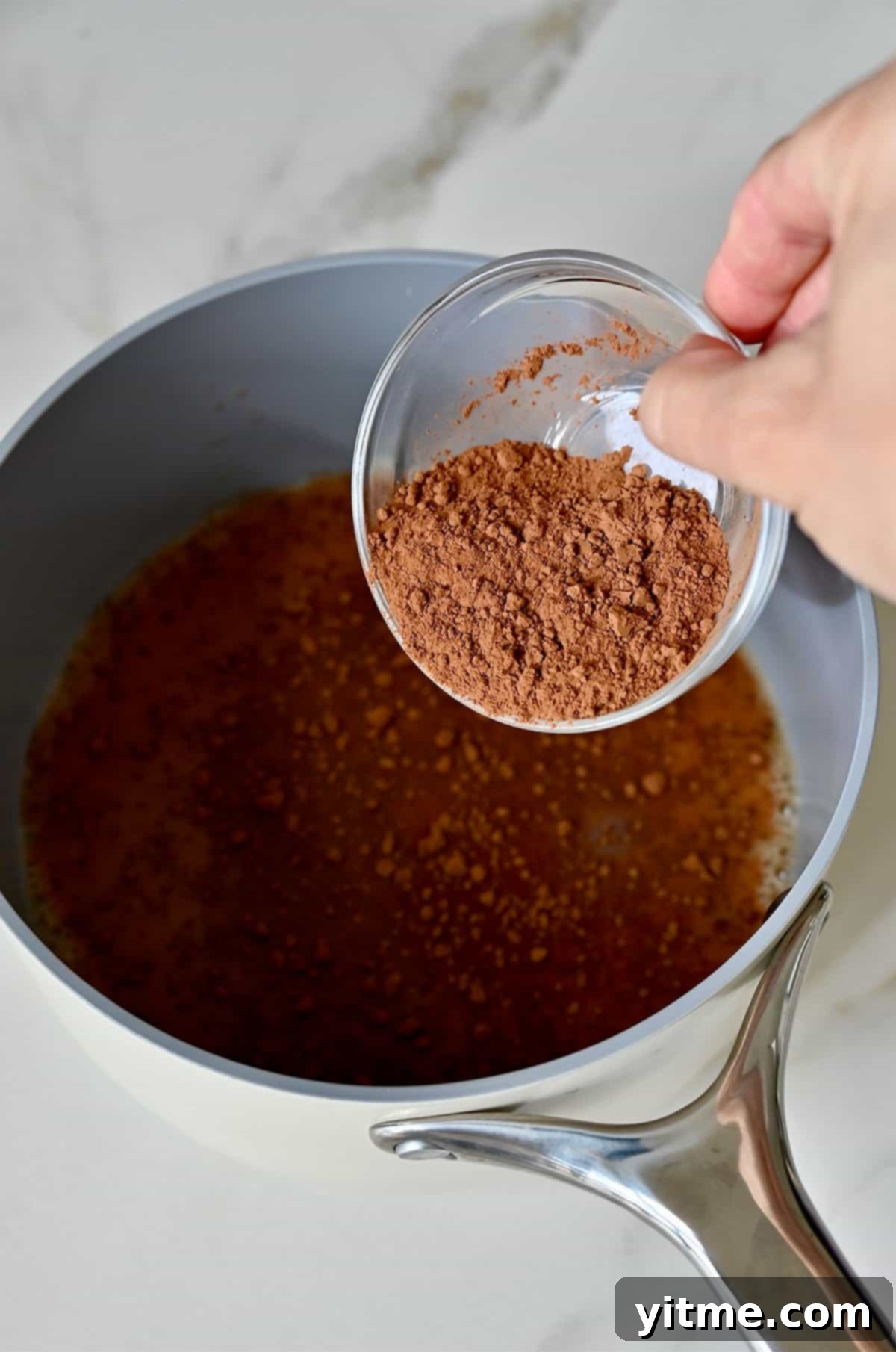 Homemade mocha with cocoa powder in a saucepan.