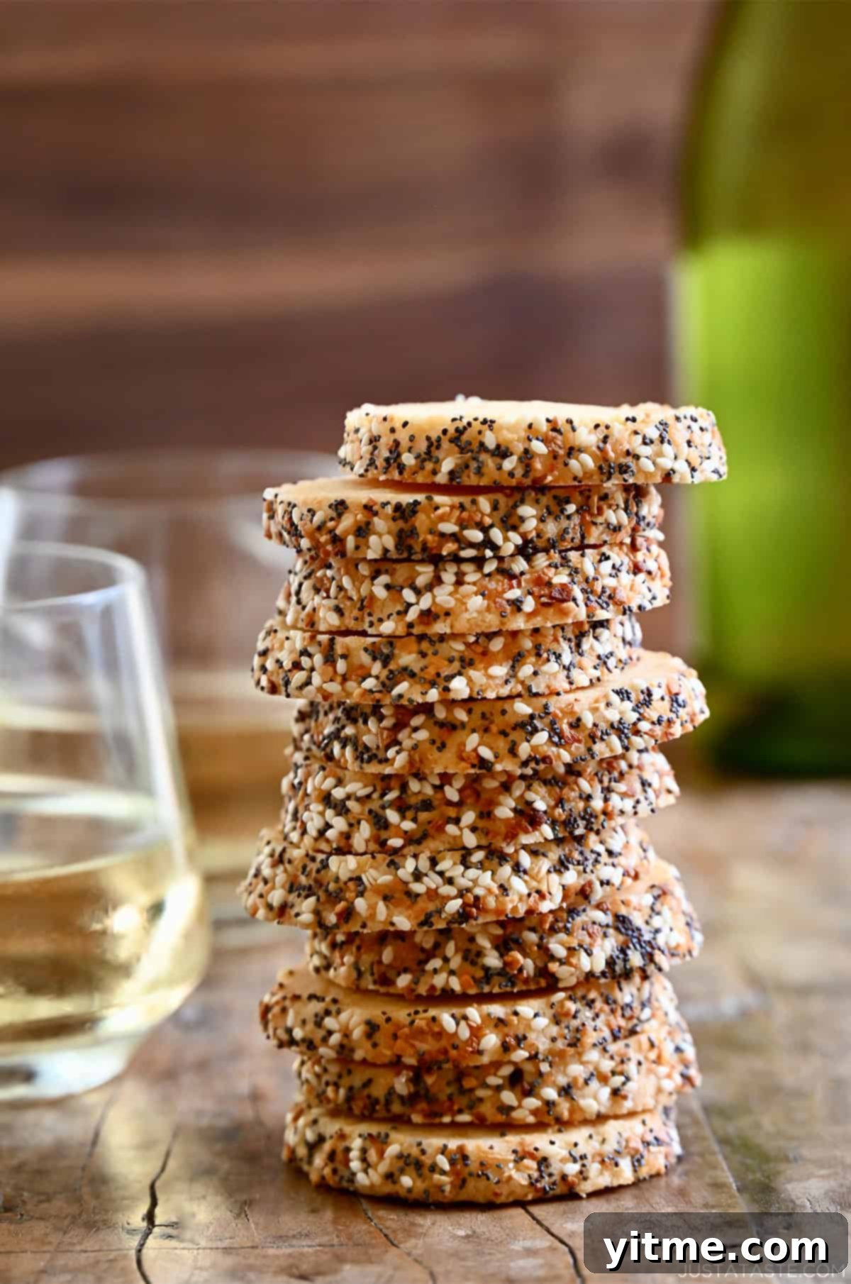 Savory shortbread cookies with everything bagel seasoning stacked high.