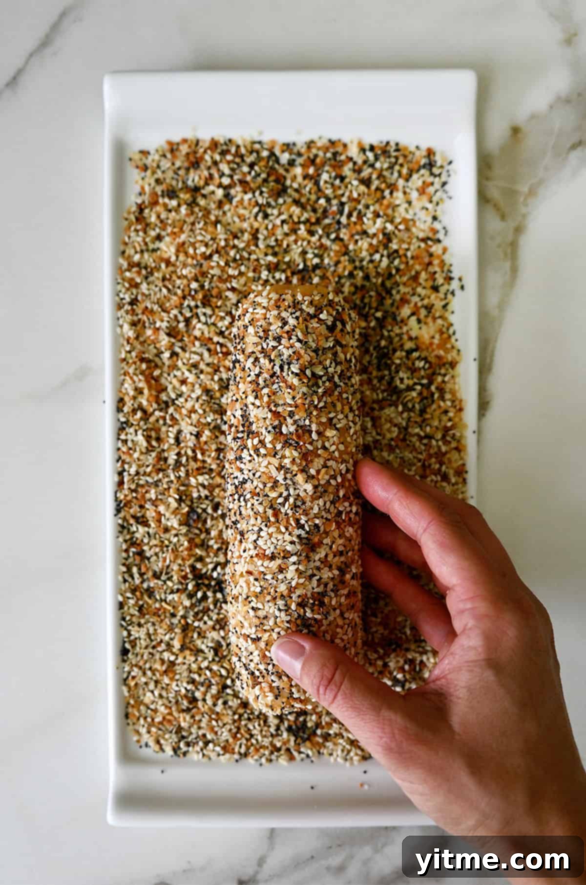 Rolling dough in seasoning.