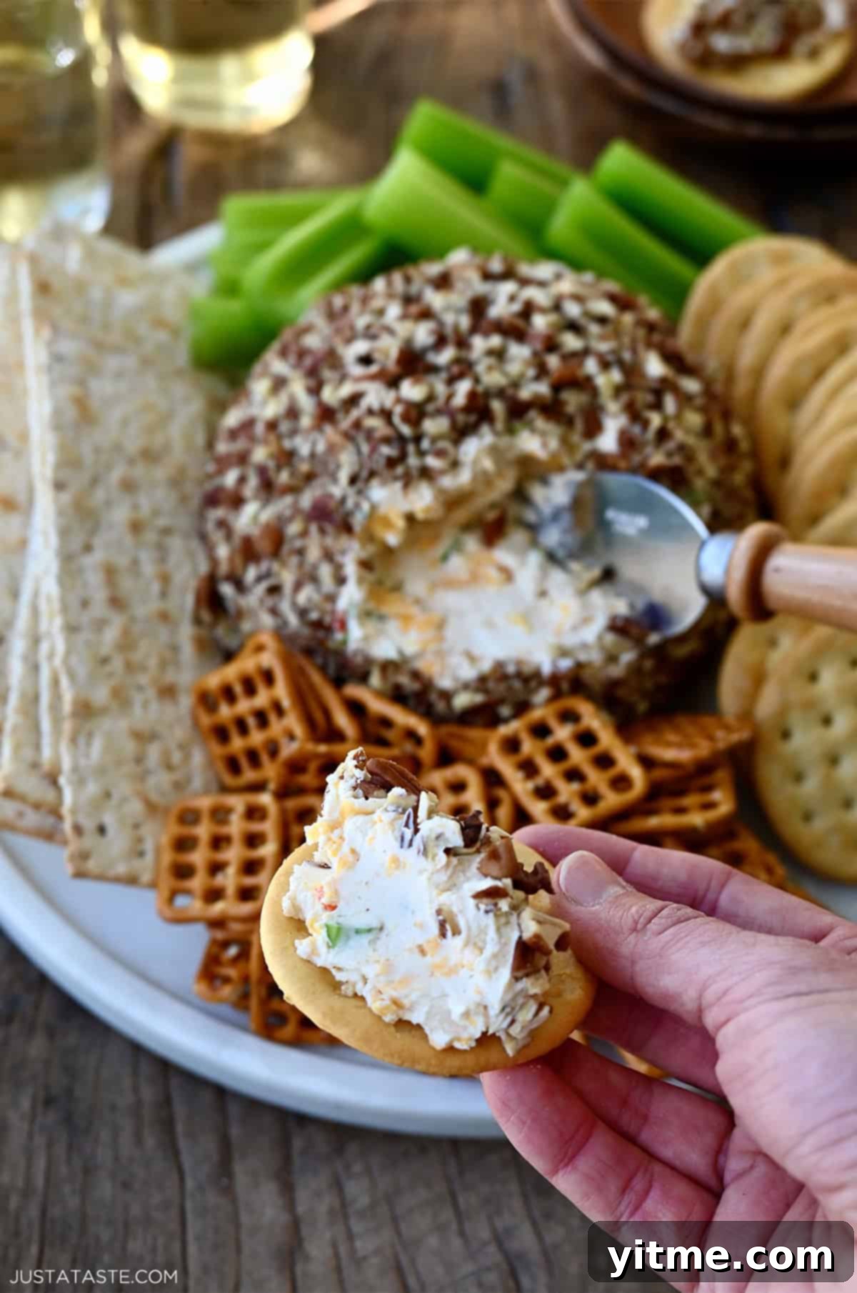 Timeless Cheese Ball 12 A scoop of cheese ball on a Ritz cracker.