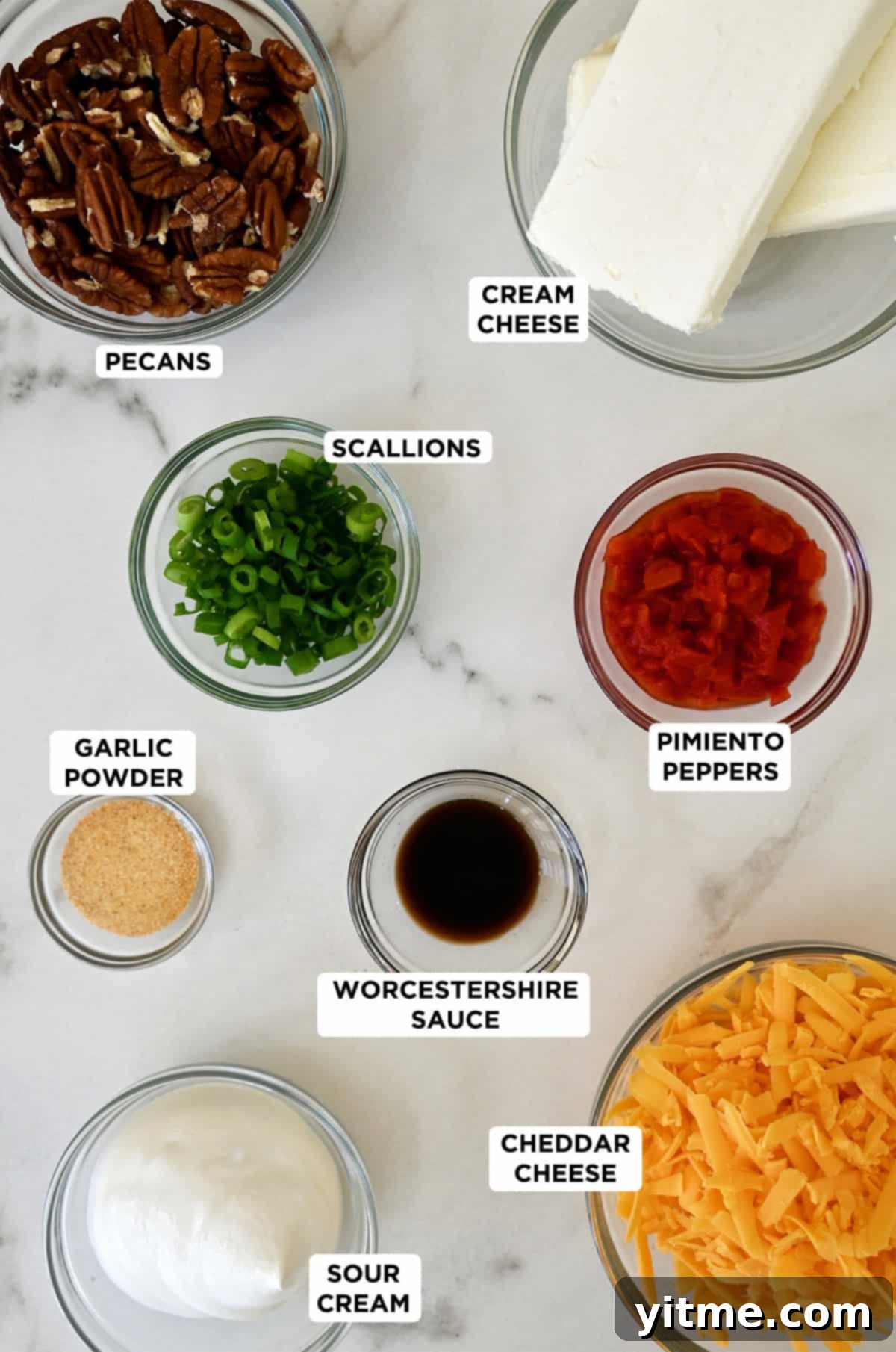 Timeless Cheese Ball 3 Cheese ball ingredients, including cream cheese, cheddar cheese, pimento peppers, chopped scallions, garlic powder, Worcestershire sauce, sour cream and crushed pecans.