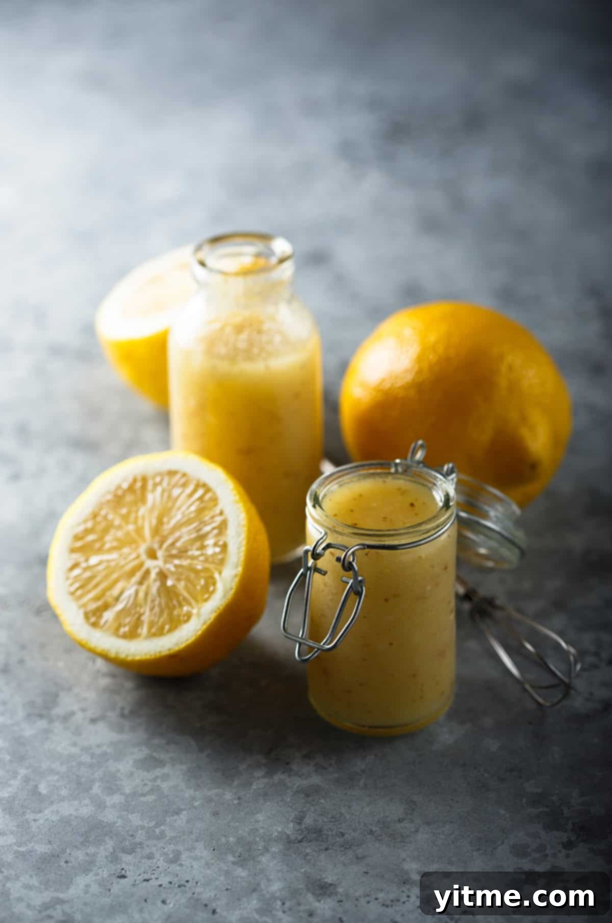 Homemade lemon vinaigrette salad dressing in a glass jar.