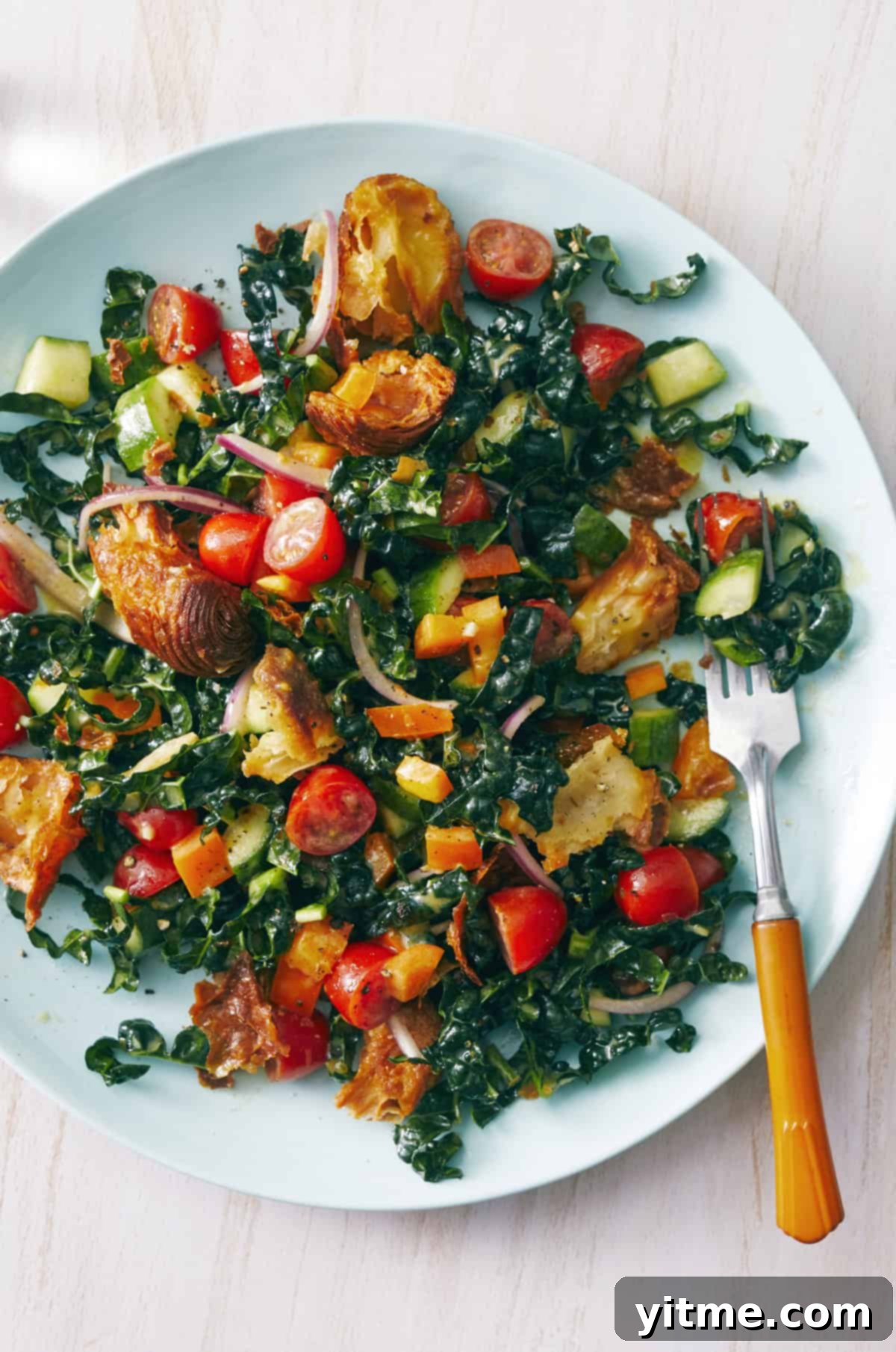 Kale panzanella salad with lemon Dijon dressing.