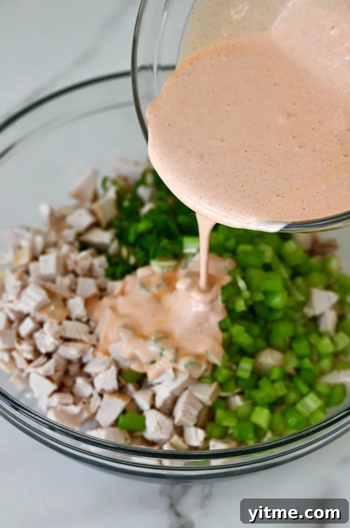 Buffalo Chicken Salad Sensation 5 Combining chicken, celery, scallions, and buffalo sauce