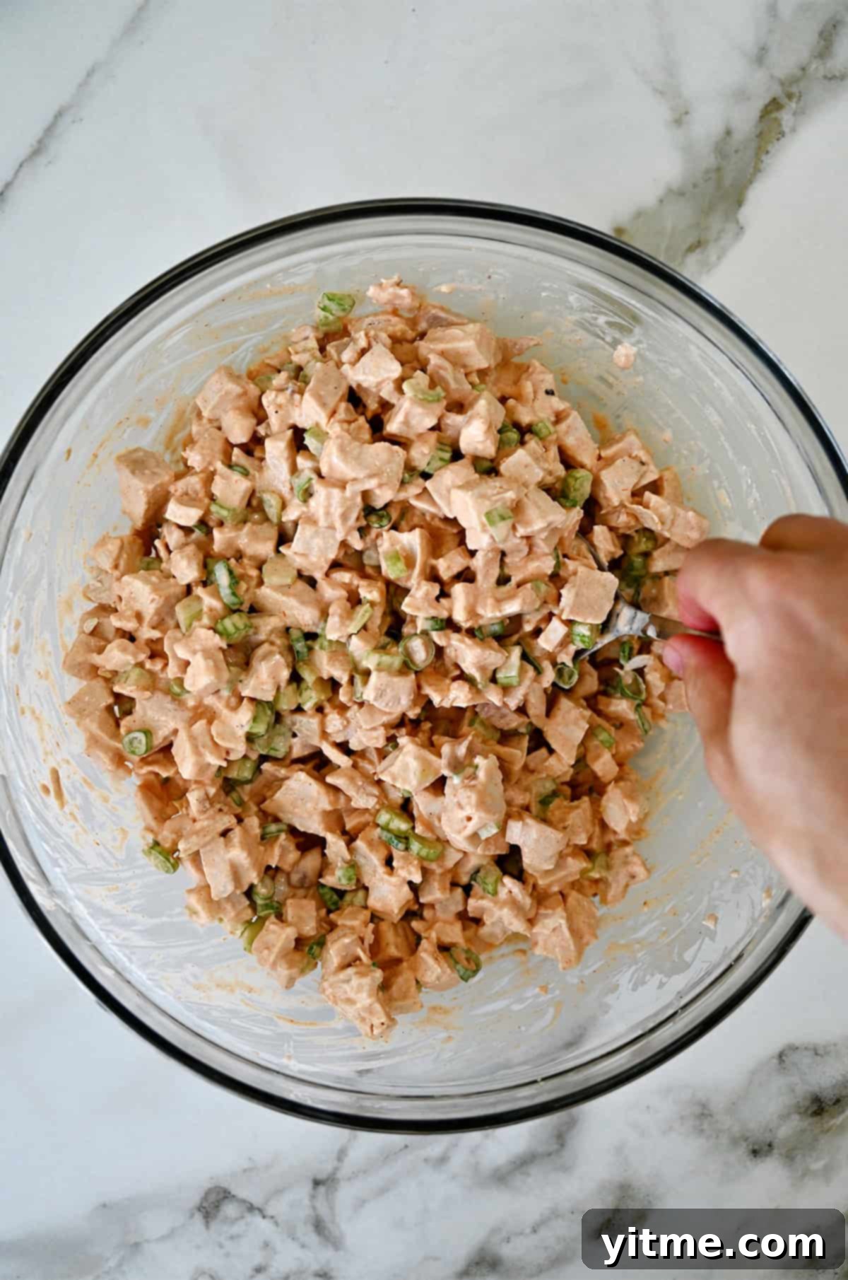 Buffalo Chicken Salad Sensation 6 Finished buffalo chicken salad in a glass bowl