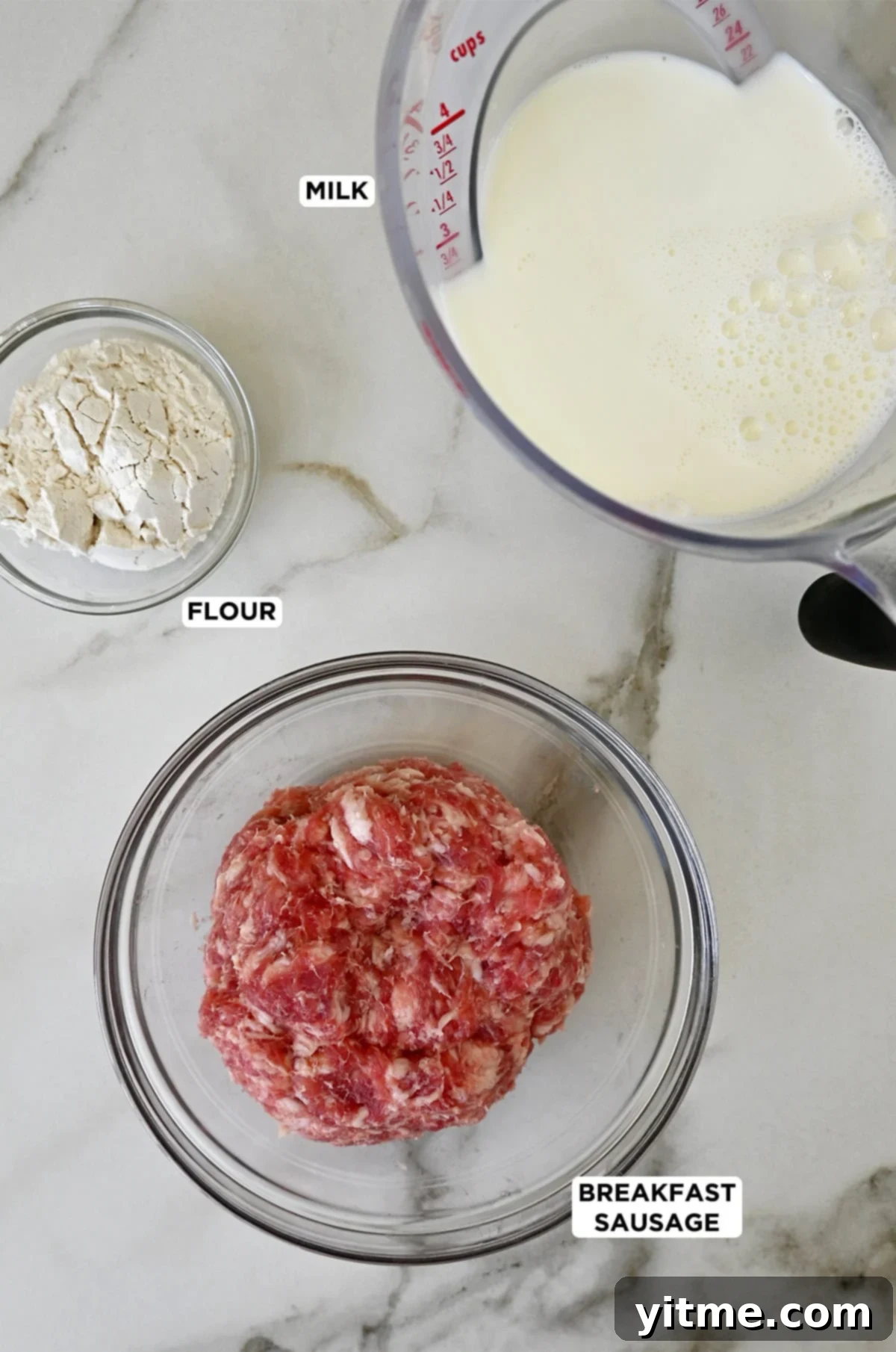 Ingredients for breakfast gravy: Flour, sausage, and milk