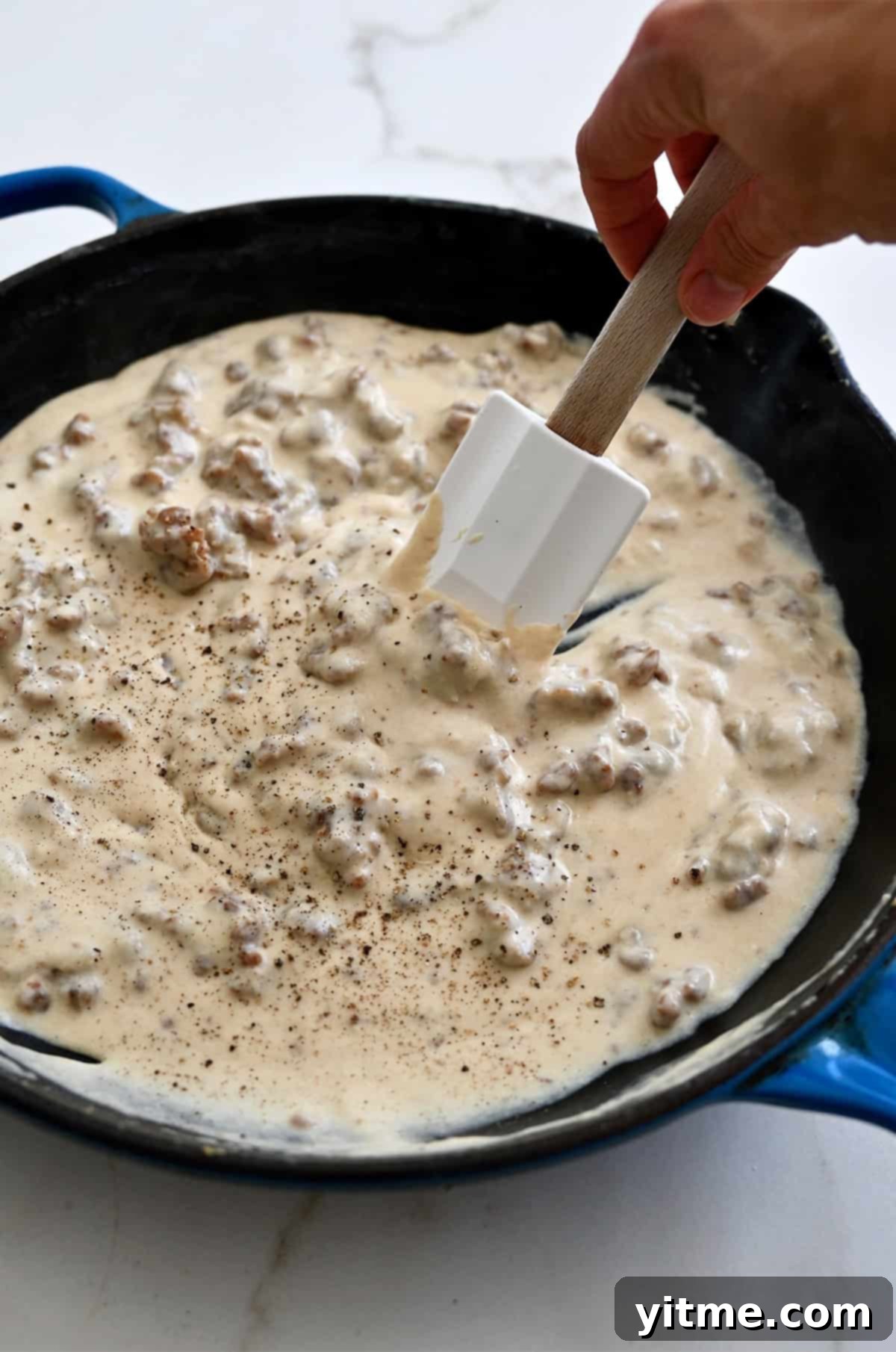 Homemade sausage gravy in a skillet