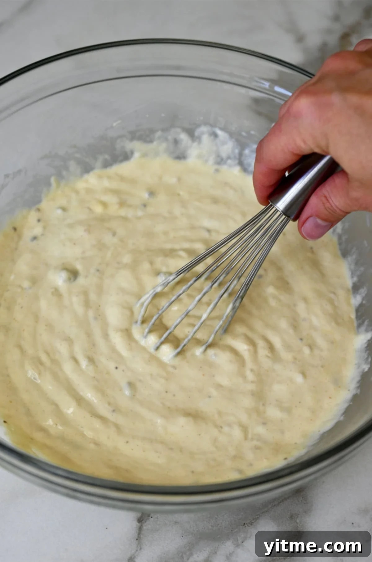 Cream of mushroom soup base for broccoli casserole. Making the creamy base for the casserole.