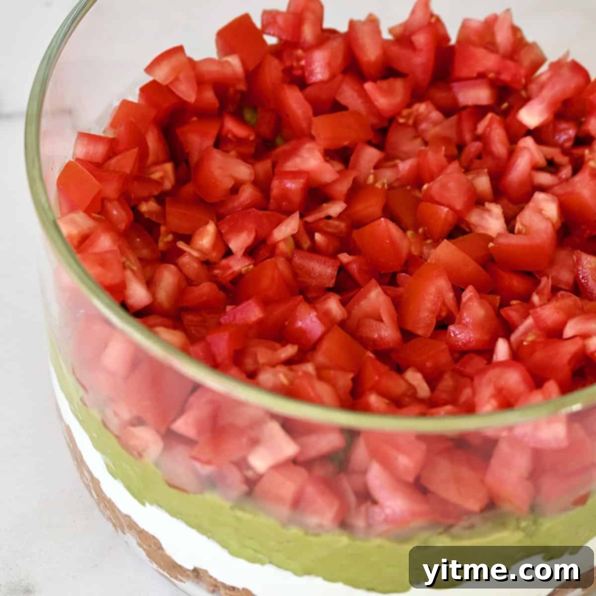 Spreading guacamole.