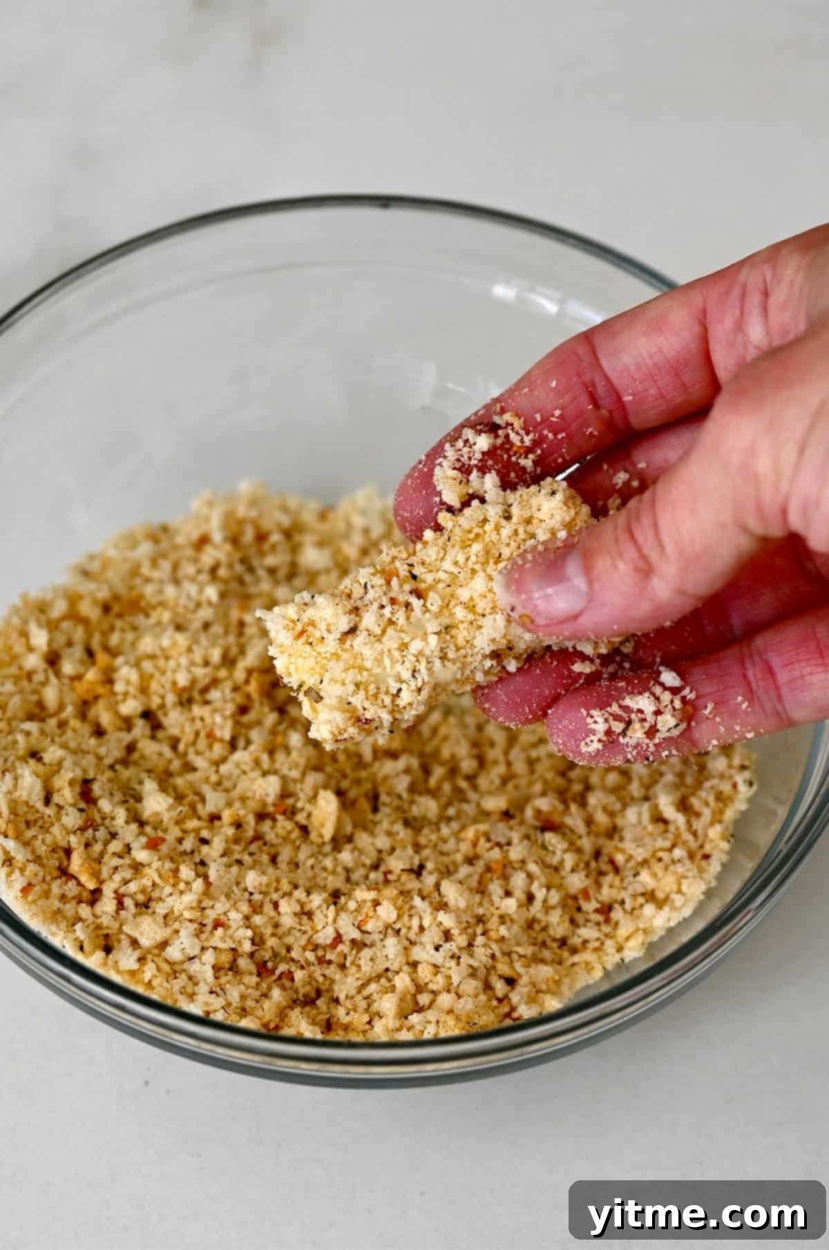 Finally, after flour and egg, the mozzarella stick is generously coated in panko breadcrumbs for extra crispiness.