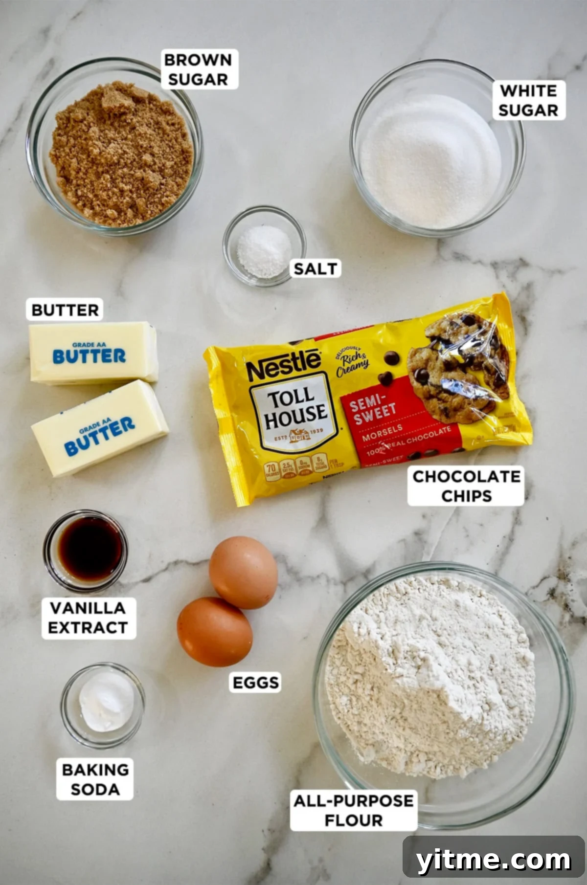 Essential ingredients for Toll House cookies laid out: flour, butter, sugar, chocolate chips, etc.