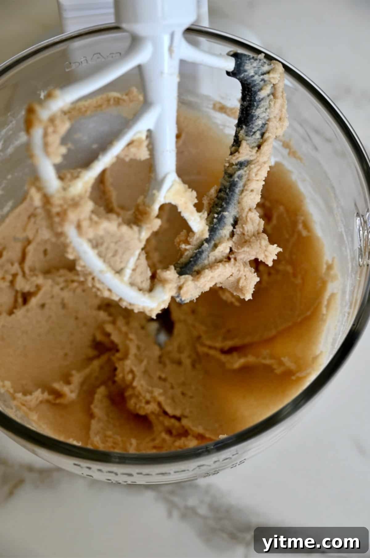 Creamed butter and sugar in a stand mixer bowl.