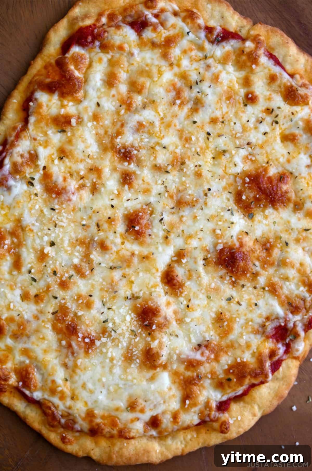 Cottage cheese pizza crust topped with marinara sauce and mozzarella cheese.