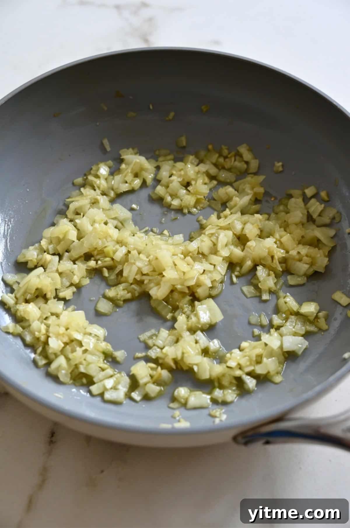 Sautéed onions and garlic in a nonstick skillet.