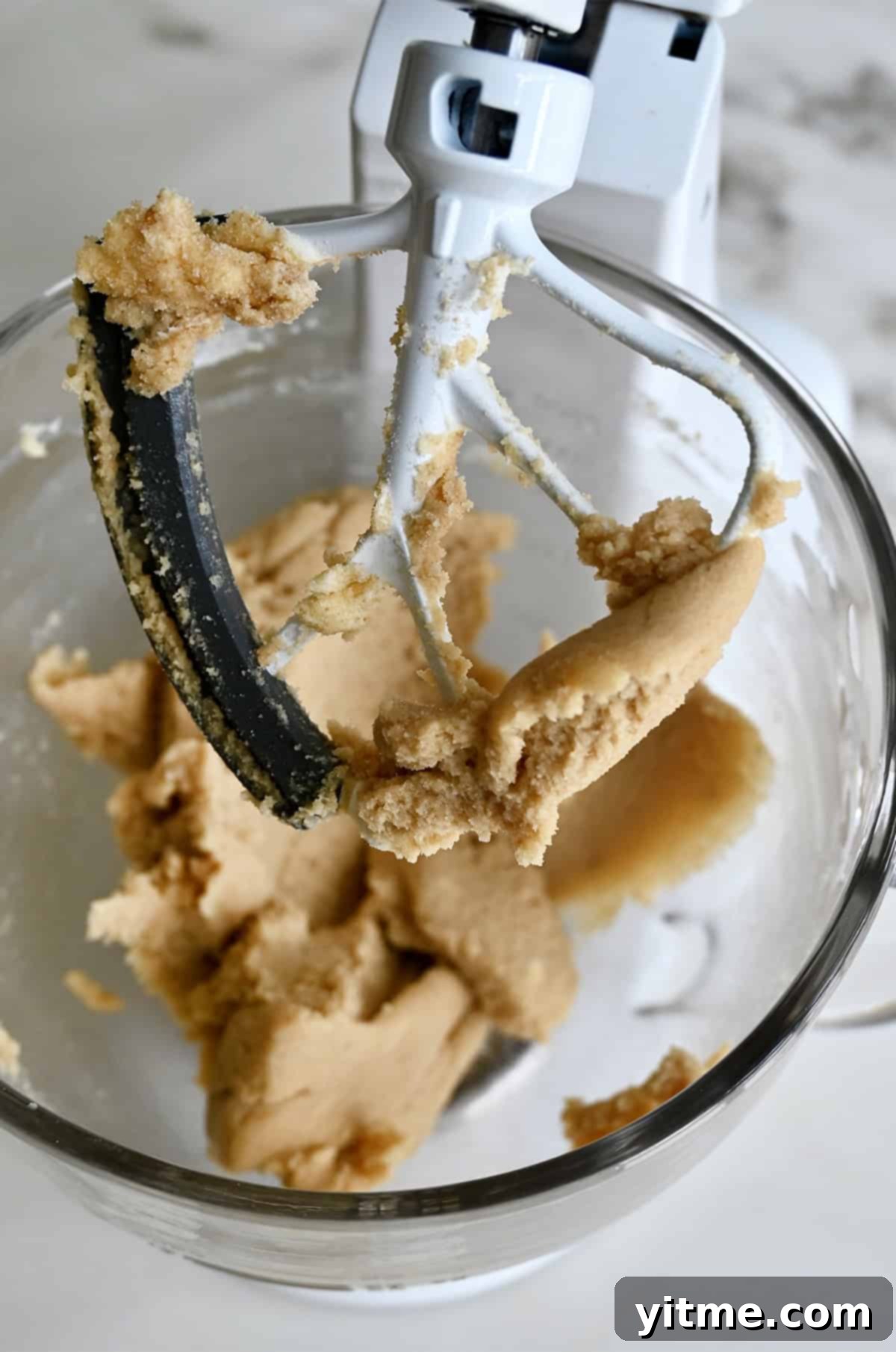 Vanilla Bean Dream Cookies 4 Creamed butter with white and brown sugars in a stand mixer bowl. The perfect fluffy texture achieved through proper creaming.