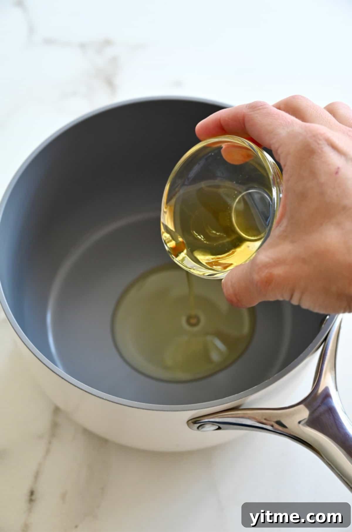 Vibrant Mexican Rice: A Flavorful Fiesta 4 Heating oil in a saucepan