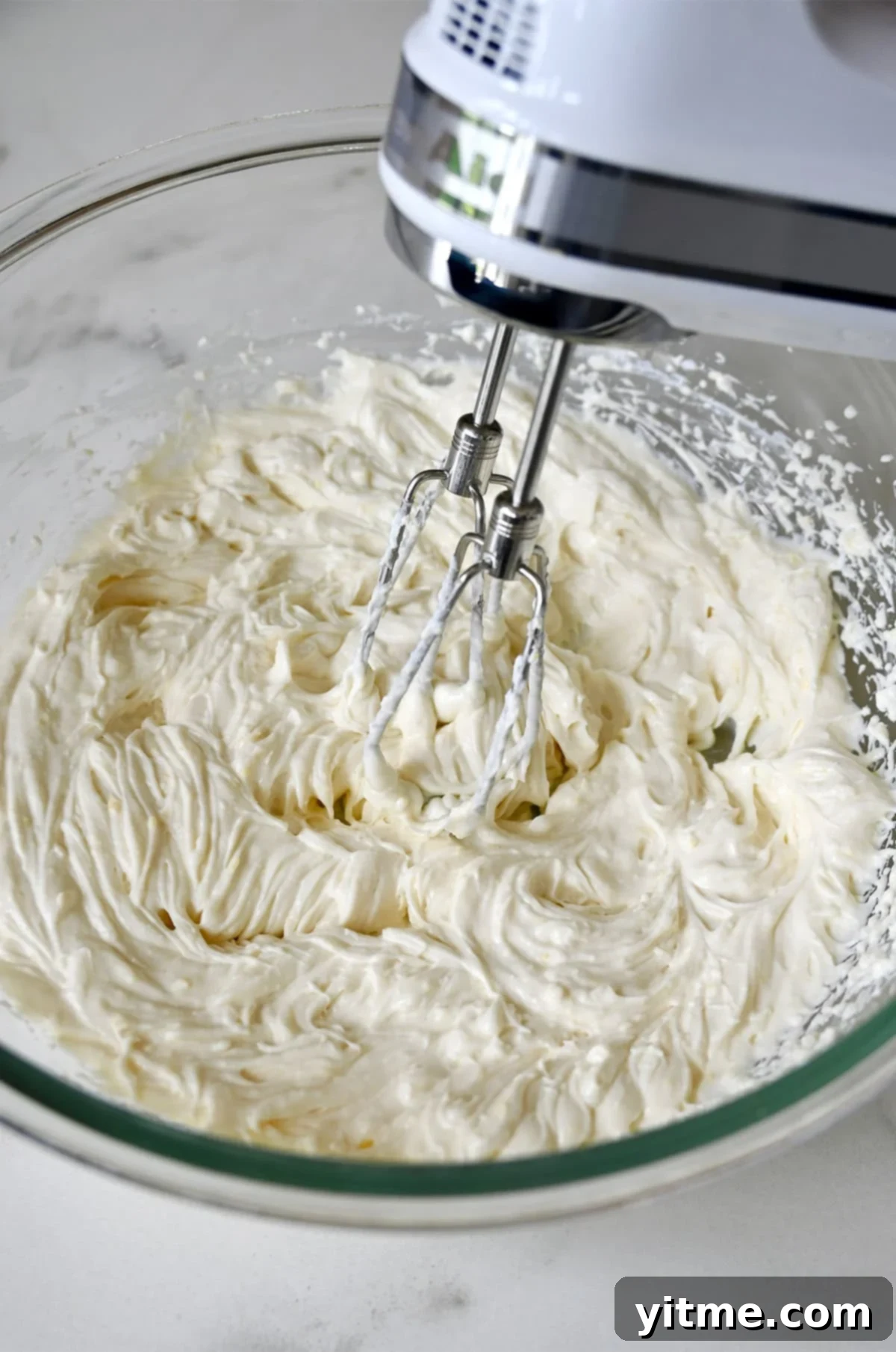 Mixing cheesecake batter